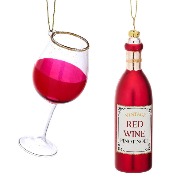 Kerstbal, fles rode wijn en een glas