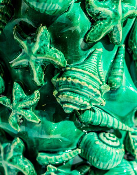 Large aqua blue crackled ceramic vase with a shell motif.