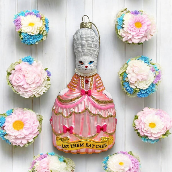 Kerstbal met een witte kat genaamd Marie Antoinette, "Laat ze eten".