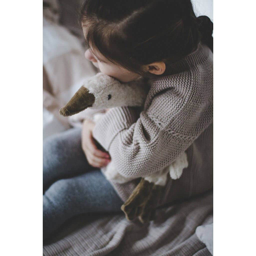 Petite bouillotte en forme d'oie blanche câline