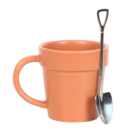 Ceramic cup shaped like a flower pot with a small scoop