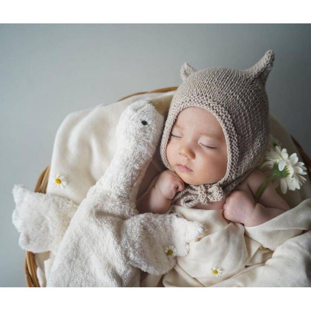 Petite bouillotte en forme d'oie blanche câline