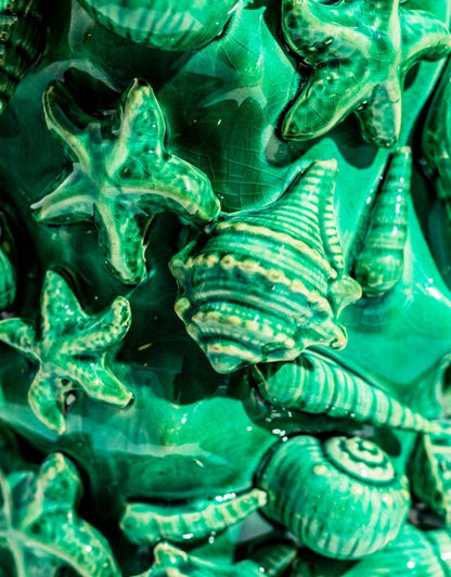 Large aqua blue crackled ceramic vase with a shell motif.