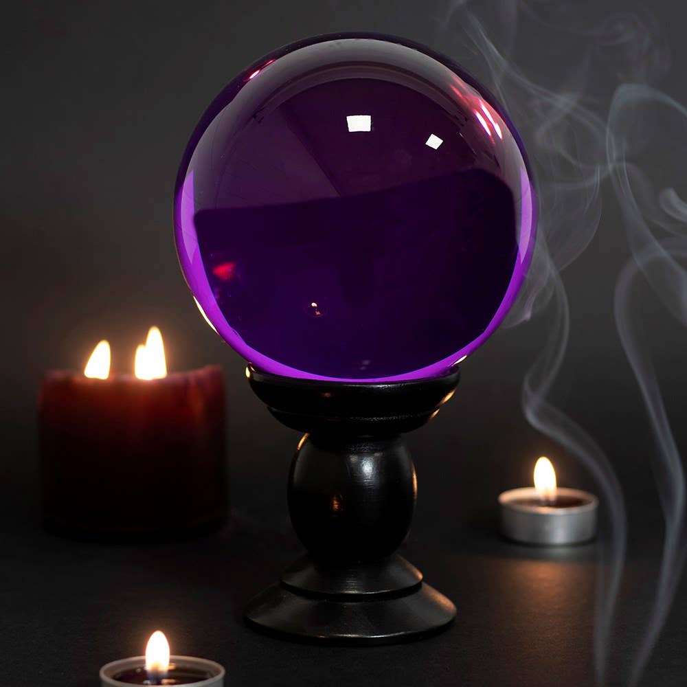 Large purple crystal ball on a stand