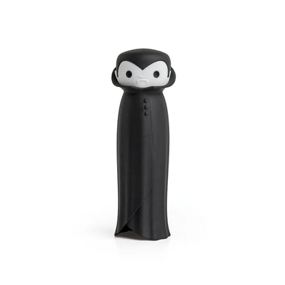 Drac N Roll cartoon vampire figure with a black cape and white face, set on a white backdrop.
