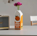 Vase Brique de Jus d’Orange