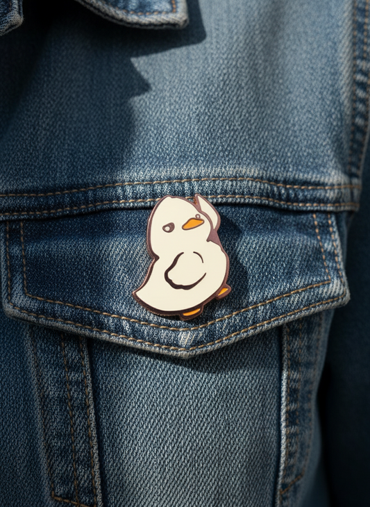 Pin's Canard Blanc avec Couteau