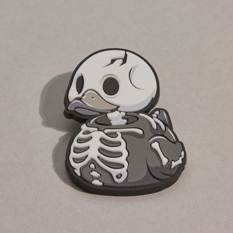 TUBBZ Numskull Skelet – glow-in-the-dark rubberen pin