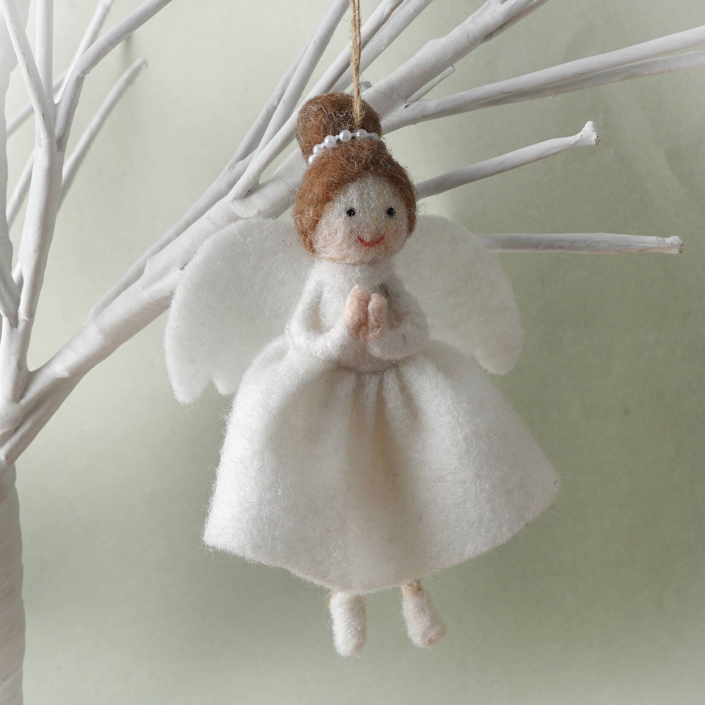 Hanging decoration in the shape of a felt angel with brown hair
