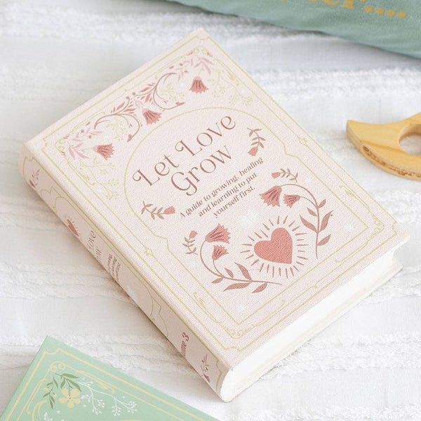 Boîte de rangement en forme de livre rose