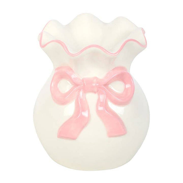 Weißer und rosa Ölbrenner mit Schleife