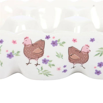 Ceramic egg holder with floral hen motif